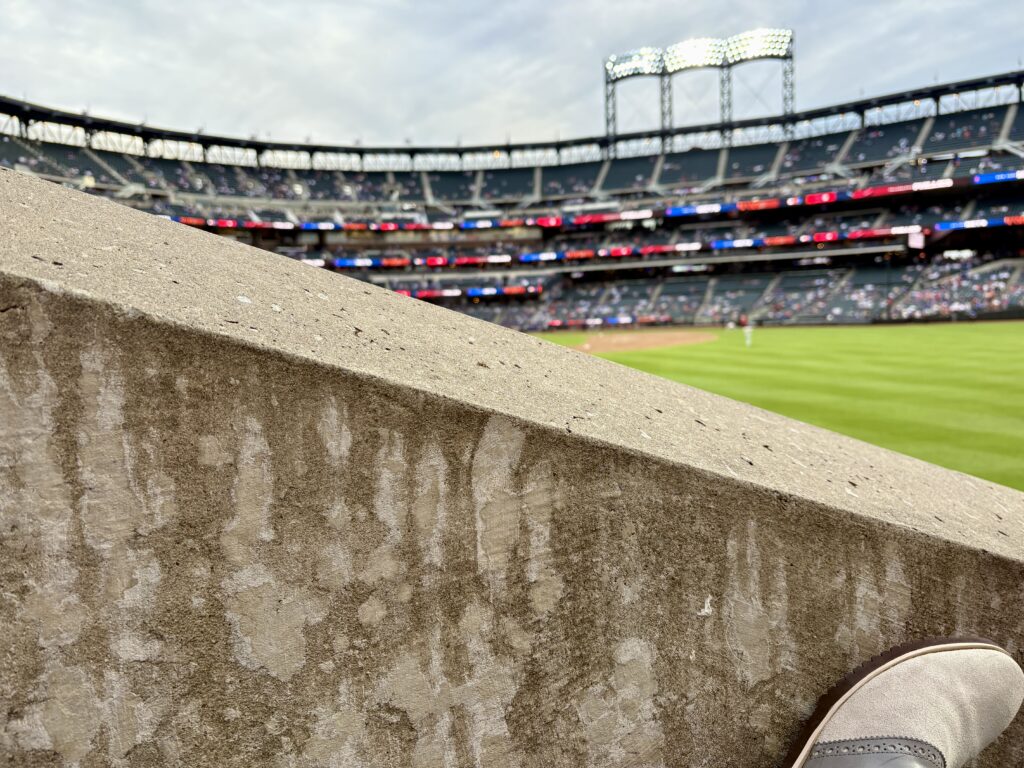 A wall. It's between me and the field. That's not ideal for a seat.